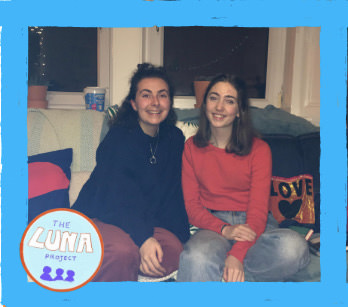 Ally and Mirren sat together on a sofa in Ally's room, smiling at the camera. There is a blue border and a LUNA logo in the bottom left.