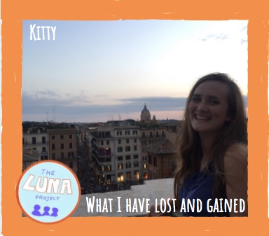Kitty is stood on the balcony in the sun. There is an orange border around the photo, and the text "what i have lost and gained".